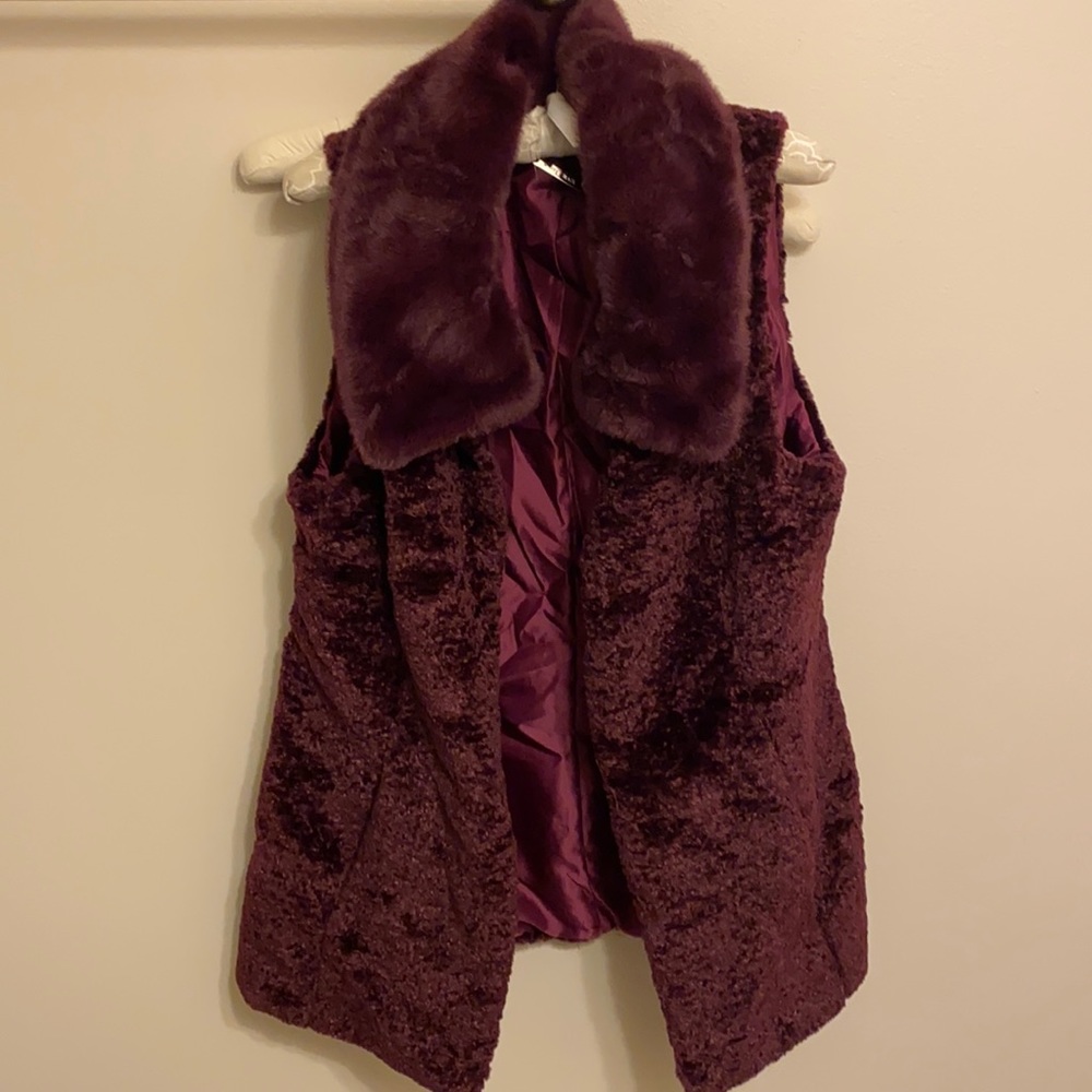 Beautiful vest, with faux fur collar, only worn once. Great for winter night out